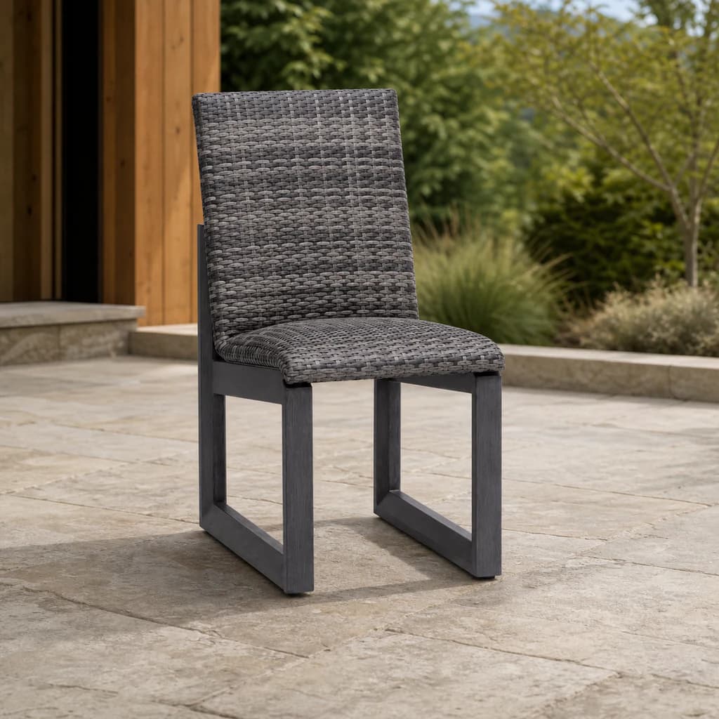 Ratana FN68411 Bergen Dining Side Chair with tall gray woven back and charcoal aluminum frame on a stone patio.