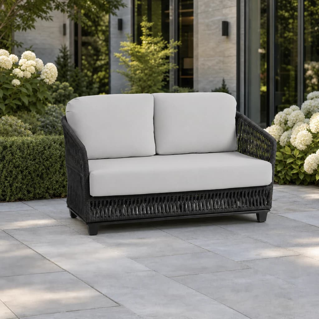 Ratana FN69002 Gemelli loveseat on a hydrangea garden terrace.
