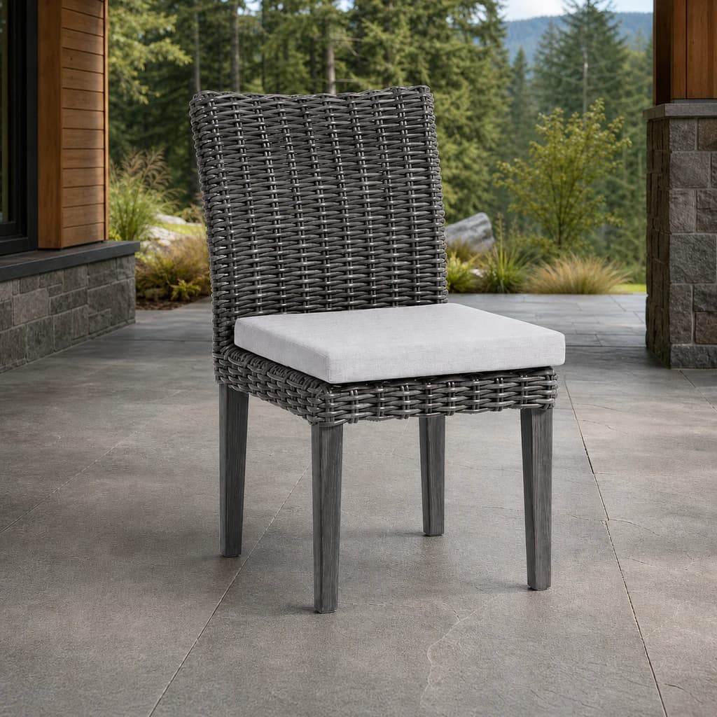 Ratana FN69311 Budapest armless Dining Side Chair in charcoal weave on an evergreen patio.