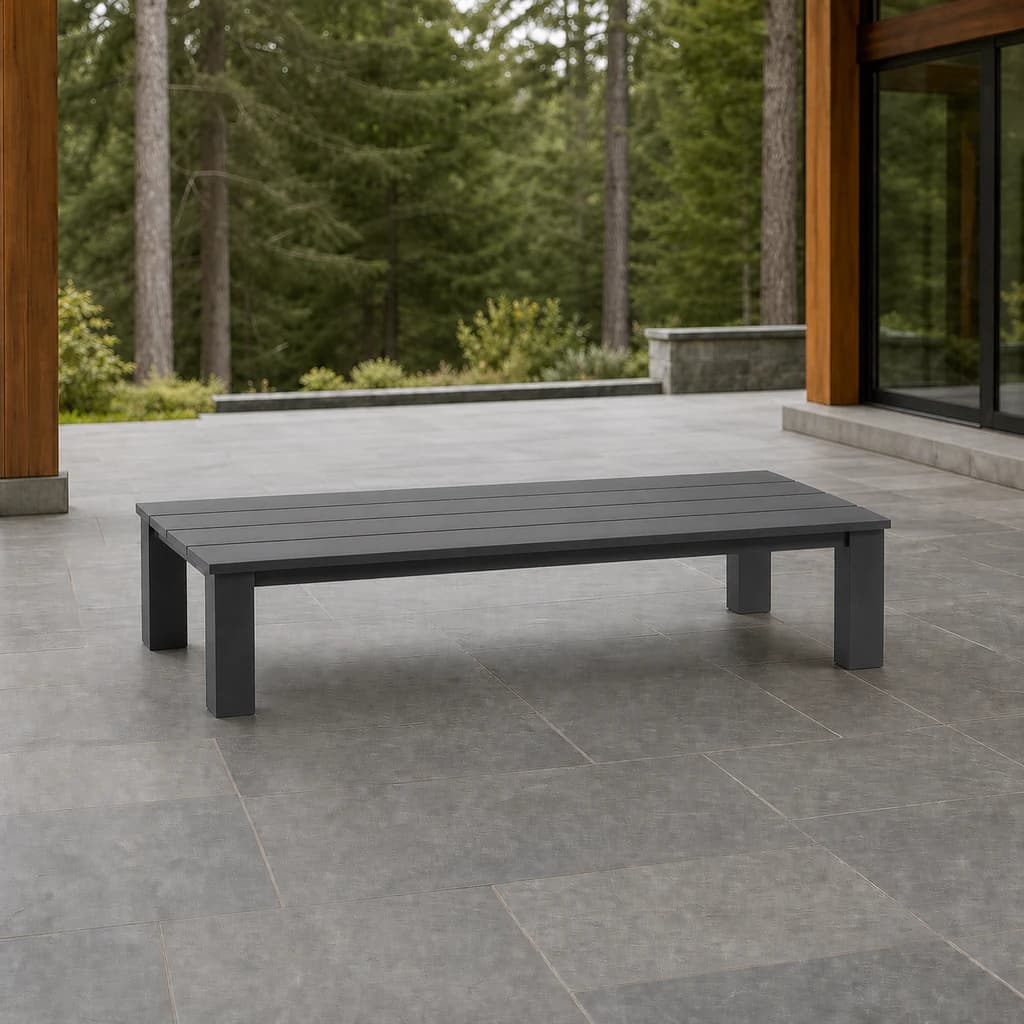 Ratana FN69404-T47 Sunbury 23-by-47-inch low Coffee Table in graphite on a covered patio.