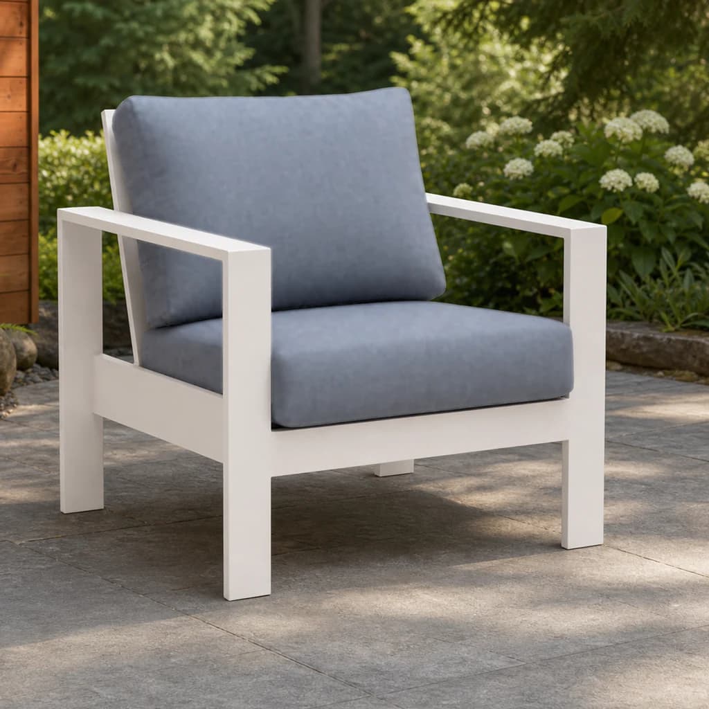 Ratana Vienna club chair with white aluminum frame and plain blue-gray cushions on a Pacific Northwest terrace.