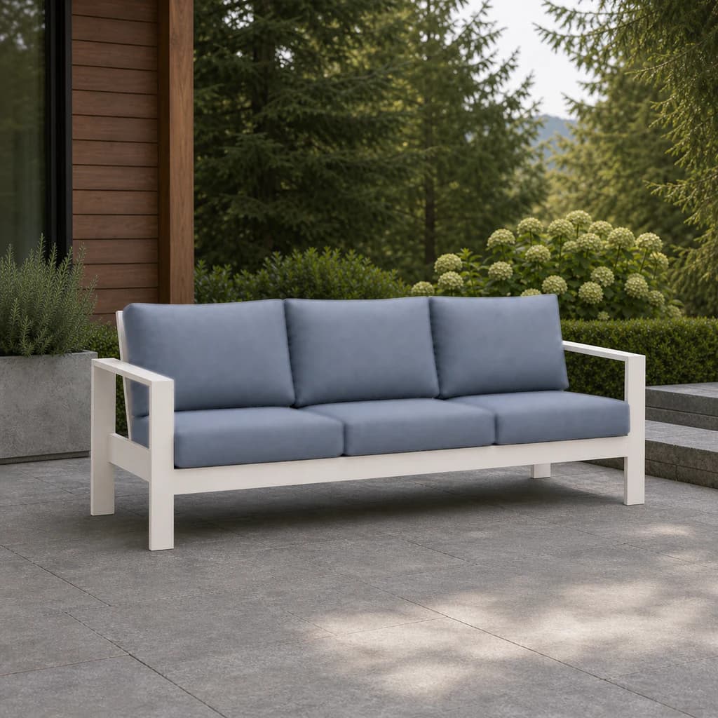 Ratana Vienna three-seat sofa with white aluminum frame and plain blue-gray cushions on a Pacific Northwest terrace.