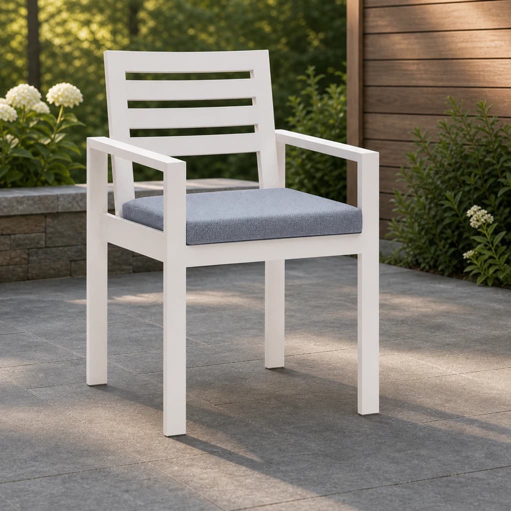 Ratana Vienna white dining arm chair with four back slats and a plain blue-gray seat cushion.