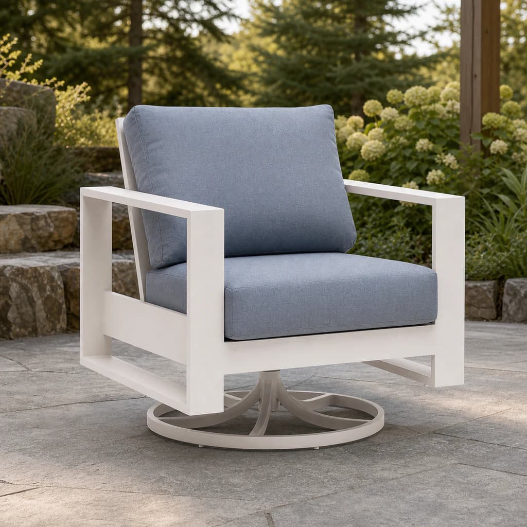 Ratana Vienna swivel rocker with white aluminum chair frame, plain blue-gray cushions and circular pedestal base.