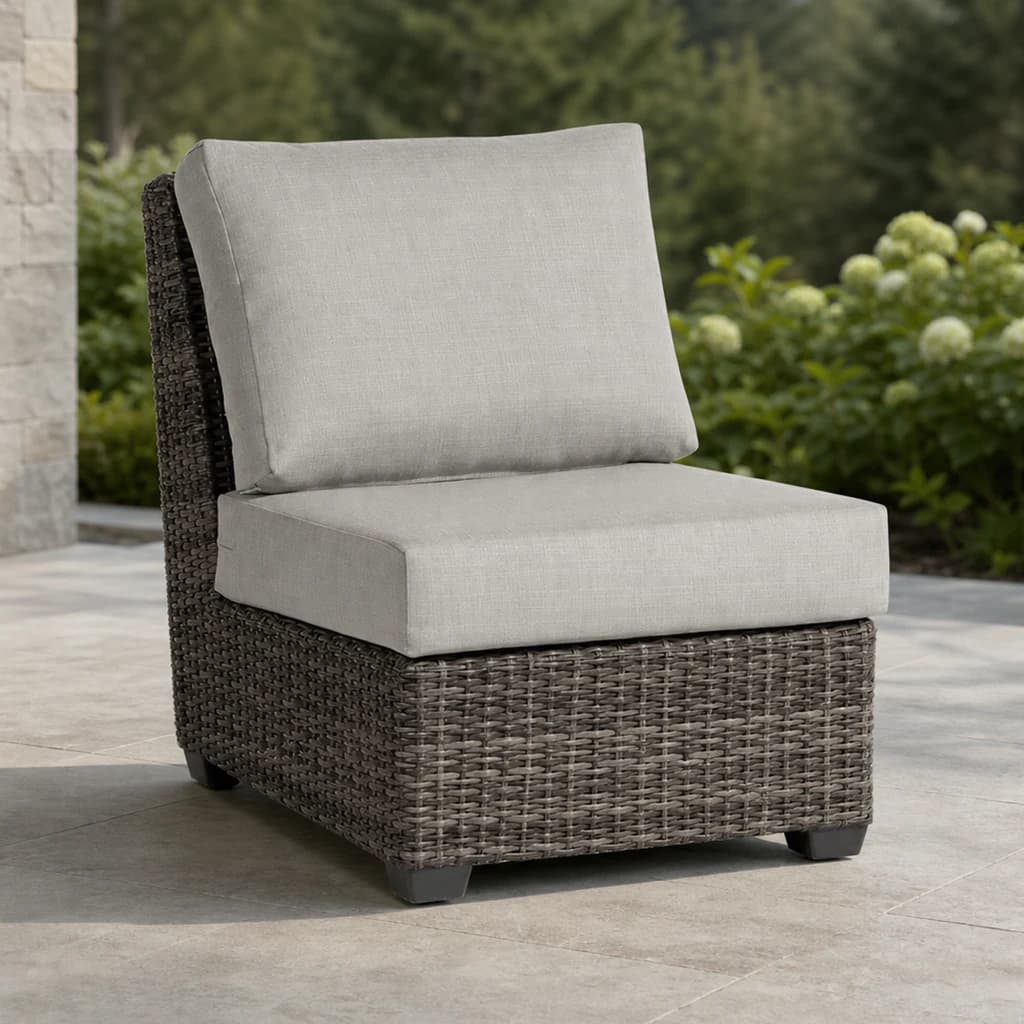 Ratana FN71253-C Coral Gables armless chair module on an evergreen patio.