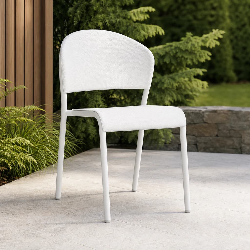 Ratana pale upholstered dining side chair on a Pacific Northwest garden patio.