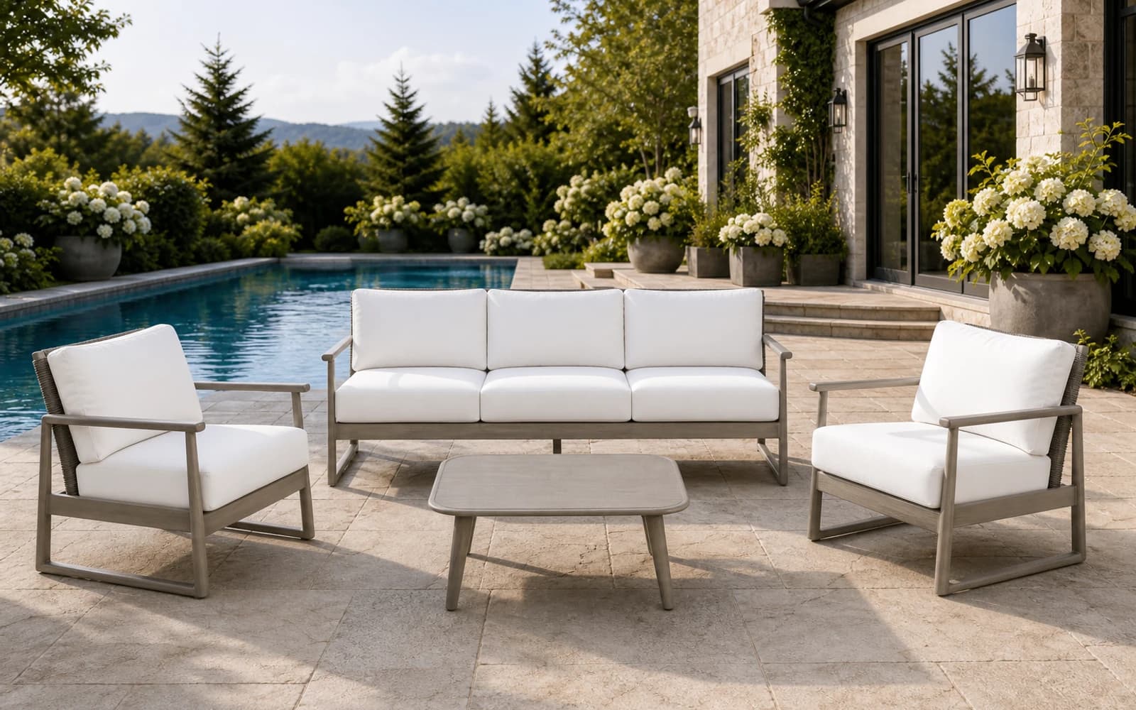 Coordinated Ratana Park West sofa, club chairs, and coffee table in a complete poolside setting