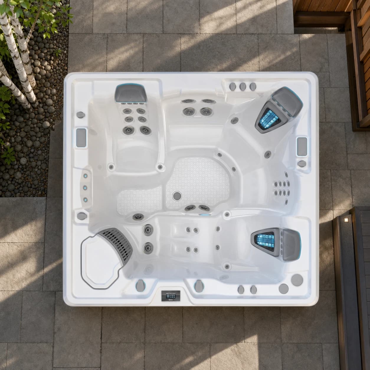 Hot Spring Envoy hot tub overhead view in a premium summer backyard setting