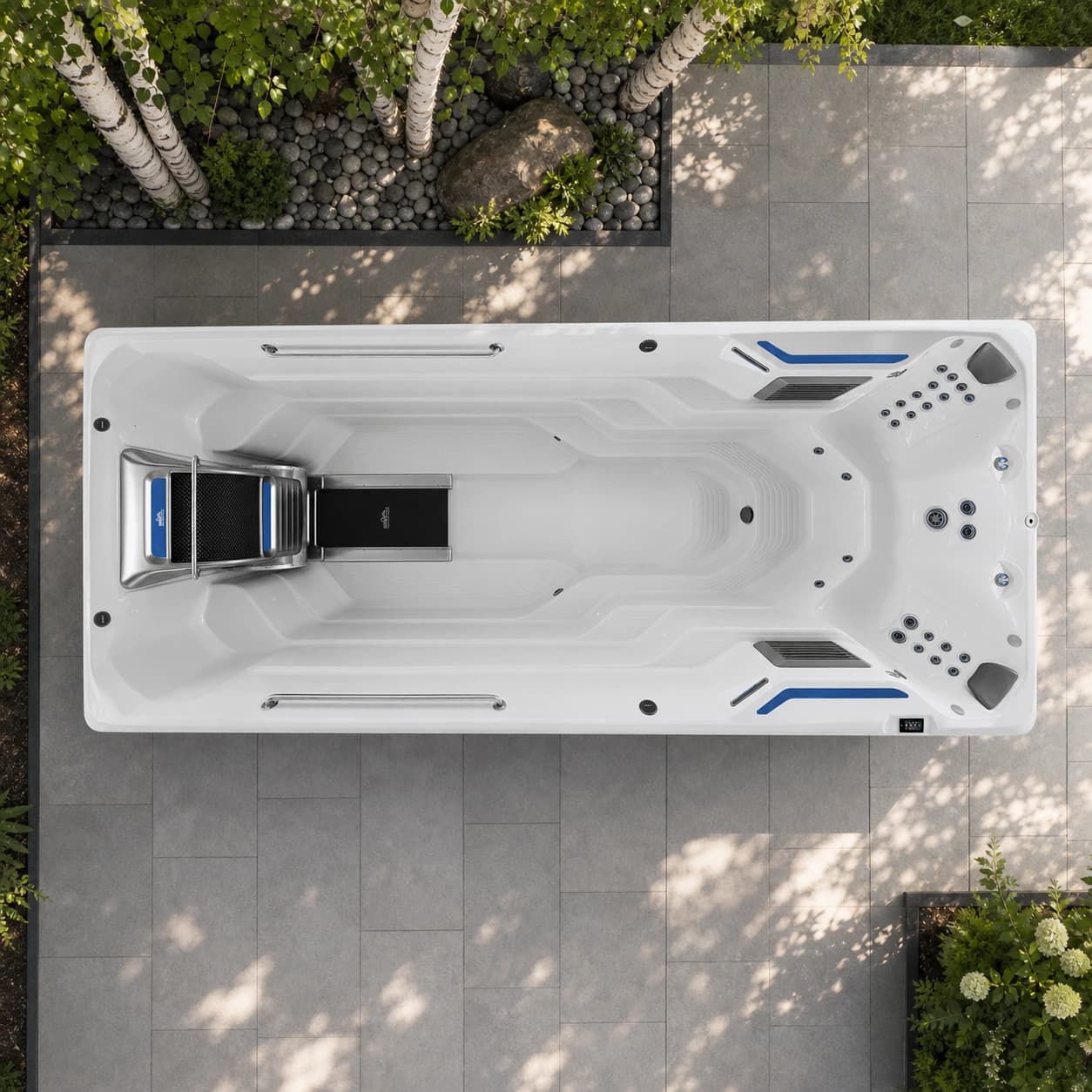 Endless Pools E700 swim spa overhead view in a premium summer backyard setting