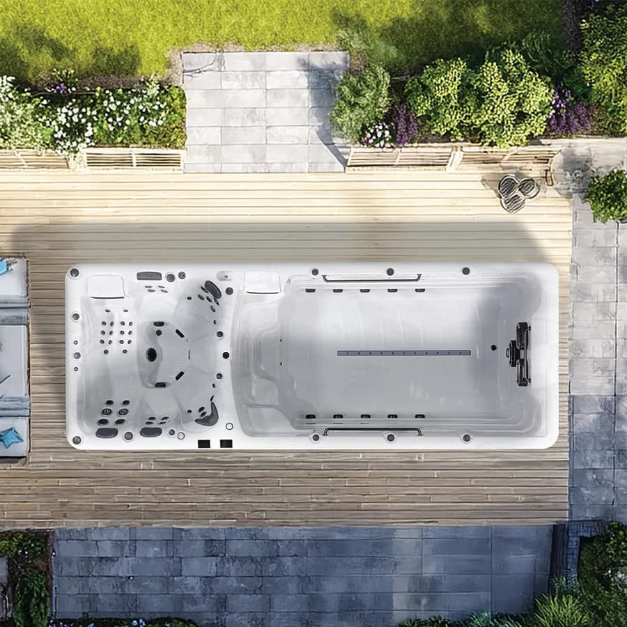Platinum Spas Helios swim spa overhead view in a premium summer backyard setting