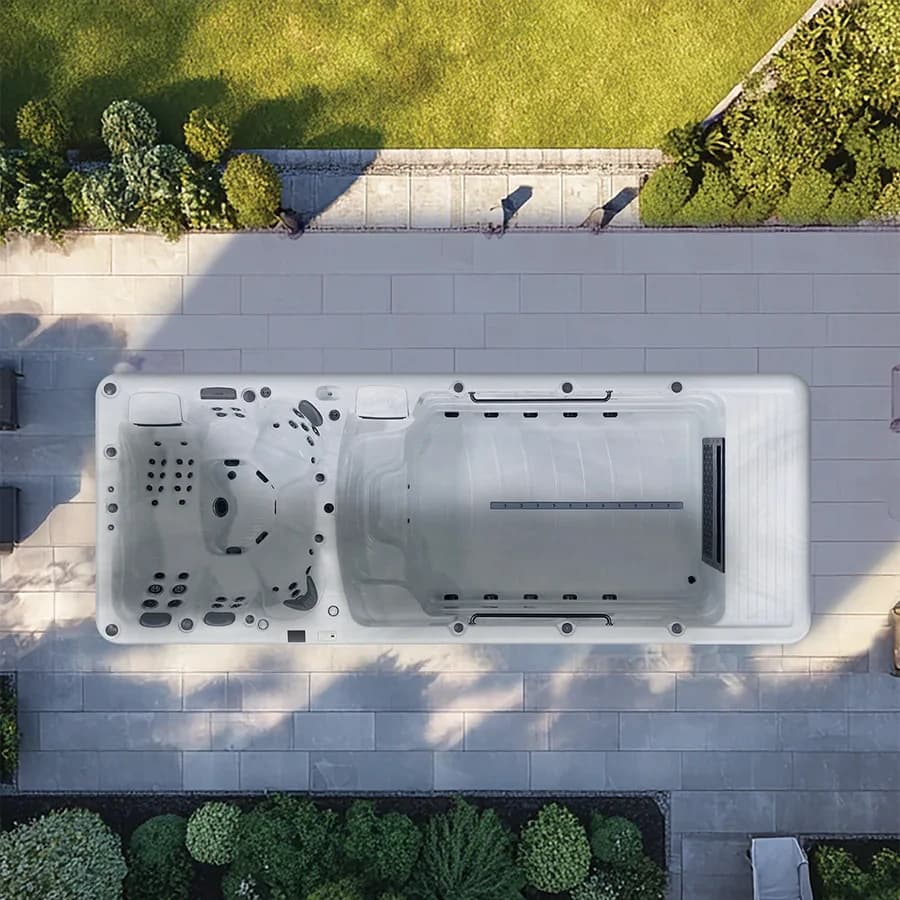 Platinum Spas Helios Pro swim spa overhead view in a premium summer backyard setting
