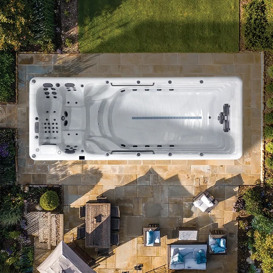 Platinum Spas Zelus swim spa overhead view in a premium summer backyard setting